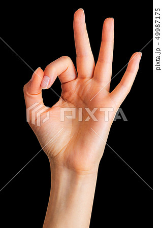 Woman hand showing mudra gesture or holding something. 49987175