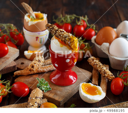 Soft-boiled egg with crisp bread Soft-boiled egg with crisp bread 49988195