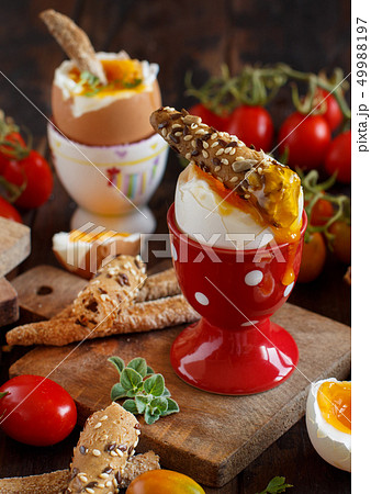 Soft-boiled egg with crisp bread Soft-boiled egg with crisp bread 49988197