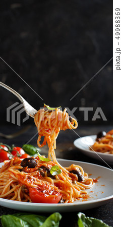 Spaghetti with tomato sauce olives and capers Spaghetti with tomato sauce olives and capers 49988369