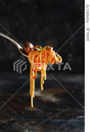 Spaghetti with tomato sauce olives and capers Spaghetti with tomato sauce olives and capers 49988370