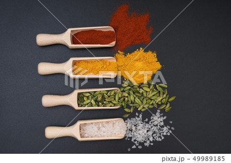 Different exotic spices on a black background, top Different exotic spices on a black background, top 49989185