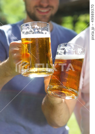 Men with glasses of the light beer 49989370