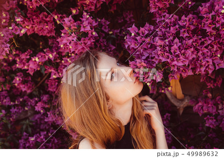 Portrait of girl that kissing bougainvillaea Portrait of girl that kissing bougainvillaea 49989632