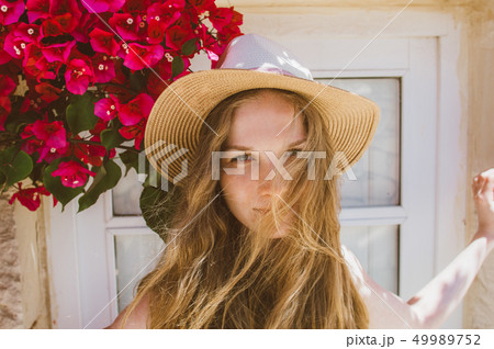 Portrait of smiling girl with tangled hair  49989752
