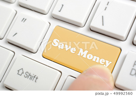 Pressing brown saving money key on keyboard Pressing brown saving money key on keyboard 49992560