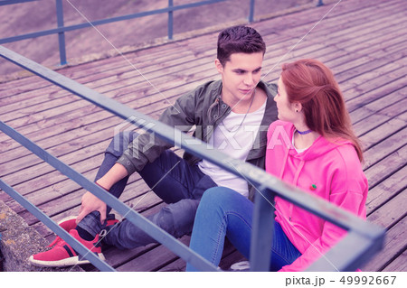Young dark-haired guy lovely looking on her ginger girl 49992667