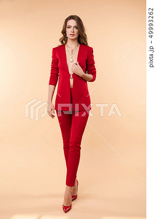 Beautiful young girl in sexy red jacket and 49993262