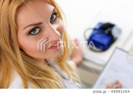 Beautiful smiling female doctor hold 49993264