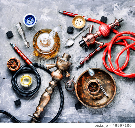 Hookah smoking with tea 49997100