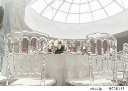Round Banquet table served. Interior of restaurant for wedding dinner, ready for guests. Decorated 49998113