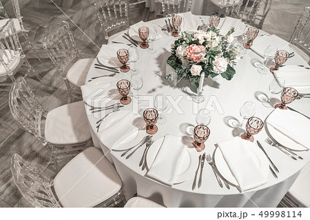 Round Banquet table served. Interior of restaurant for wedding dinner, ready for guests. Decorated 49998114
