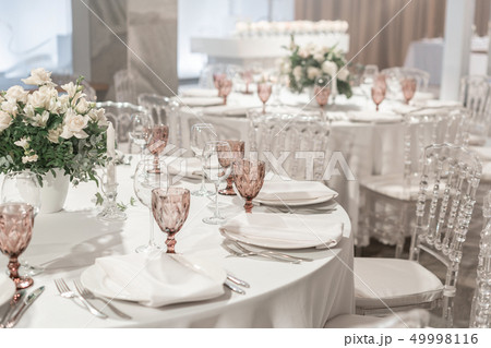 Round Banquet table served. Interior of restaurant for wedding dinner, ready for guests. Decorated 49998116