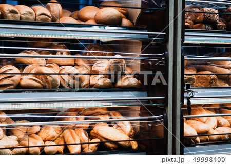 background - shelves with fresh bread in a grocery background - shelves with fresh bread in a grocery 49998400