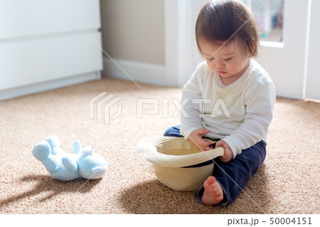 Toddler boy playing with his toys 50004151