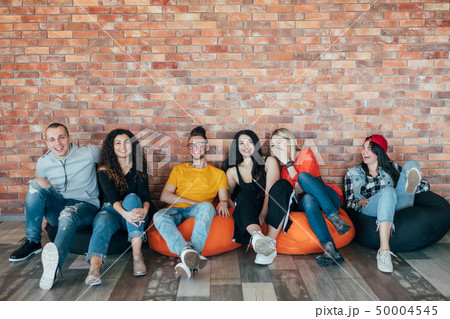 millennials chilling out leisure zone laughing 50004545