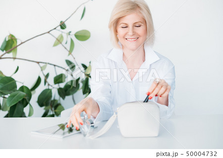 smiling aged lady beauty products choice advice smiling aged lady beauty products choice advice 50004732