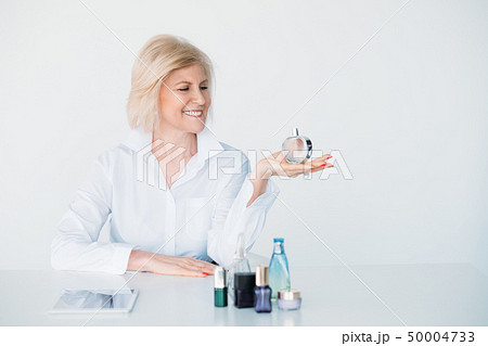 smiling stylish aged lady lifestyle perfume choice smiling stylish aged lady lifestyle perfume choice 50004733