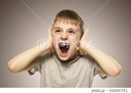 Boy closed his ears with his hands and shouts 50004791