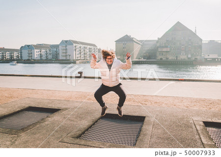 adult person rejoices like child. Playground trampoline in ground, children trampoline, springs adult person rejoices like child. Playground trampoline in ground, children trampoline, springs 50007933