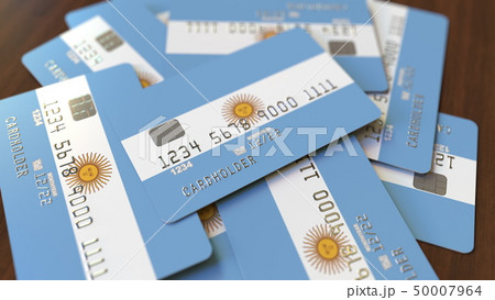Pile of credit cards with flag of Argentina. Argentinean banking system conceptual 3D rendering 50007964