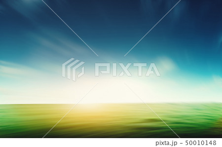Grass and blue sky motion blur Grass and blue sky motion blur 50010148