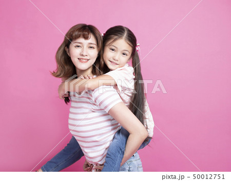happy beautiful mother playing her child happy beautiful mother playing her child 50012751