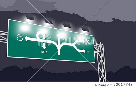 Highway or motorway green signage at nighttime 50017748