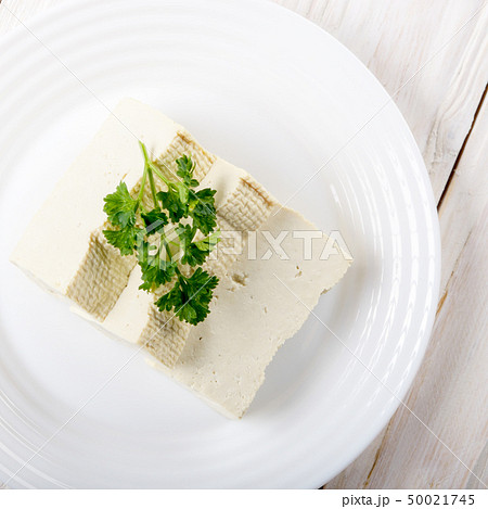 Flat lay view at Soy Bean curd tofu on clay dish 50021745