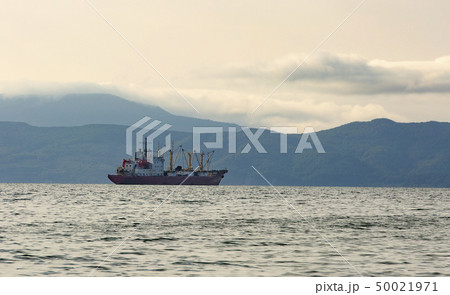 fishing boat in gray morning on Pacific ocean off 50021971