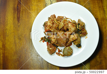 spicy stir fried pork leg with eggplant curry spicy stir fried pork leg with eggplant curry 50022997