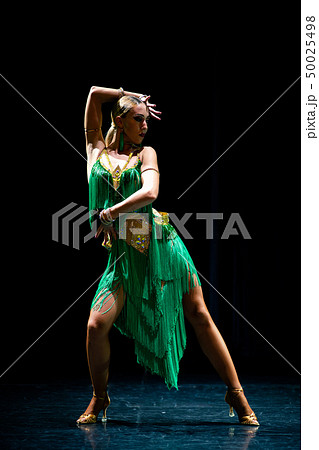 young beautiful female dancer posing on black background 50025498