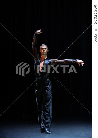 female muscular ballroom dancer making pose isolated on black 50025500