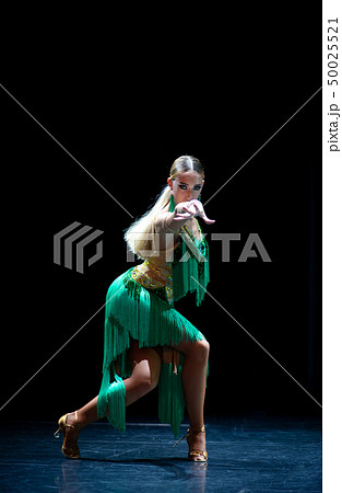 young beautiful female dancer posing on black background young beautiful female dancer posing on black background 50025521