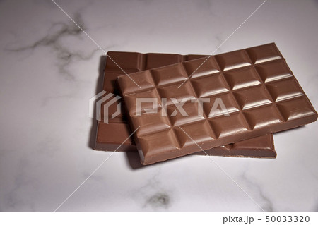 stack of tasty chocolate bars stack of tasty chocolate bars 50033320