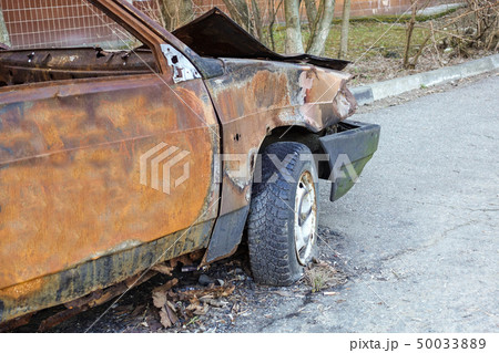 Burnt, abandoned passenger car close-up. Russia. Burnt, abandoned passenger car close-up. Russia. 50033889