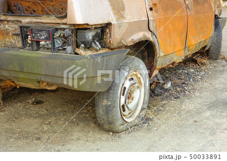Burnt, abandoned passenger car close-up. Russia. 50033891
