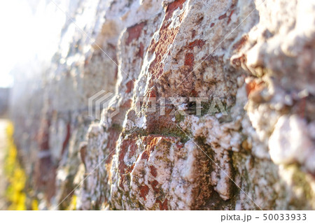 uneven surface of the brick wall is illuminated by uneven surface of the brick wall is illuminated by 50033933
