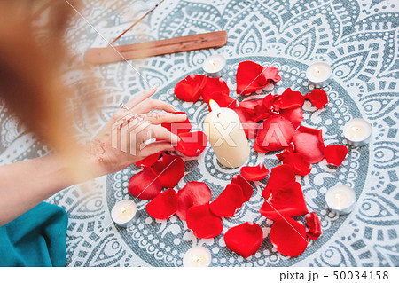 Dance of female hands with mehendi over the altar 50034158