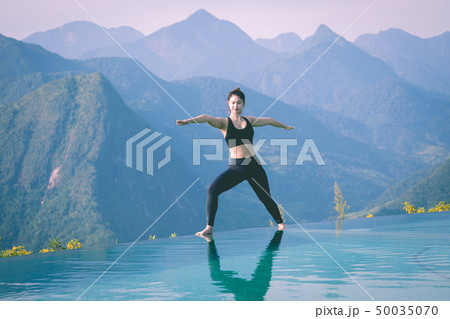 woman practice yoga Warrior I or Virabhadrasana woman practice yoga Warrior I or Virabhadrasana 50035070