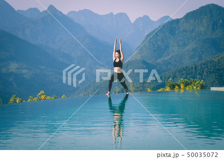 woman practice yoga Warrior I or Virabhadrasana woman practice yoga Warrior I or Virabhadrasana 50035072