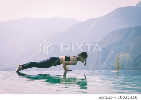 woman practice yoga Plank or Phalakasana Pose woman practice yoga Plank or Phalakasana Pose 50035310