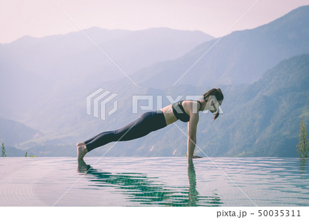 woman practice yoga Plank or Phalakasana Pose woman practice yoga Plank or Phalakasana Pose 50035311