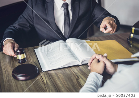 Businessman and Male lawyer or judge consult Businessman and Male lawyer or judge consult 50037403