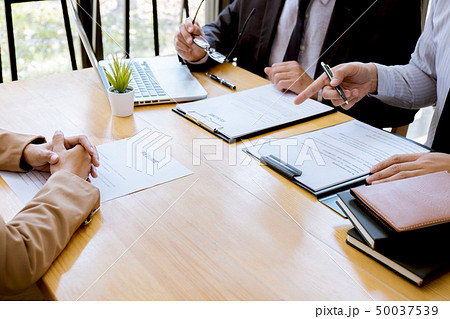 Two selection committee manager reading a resume Two selection committee manager reading a resume 50037539