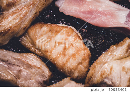 cooking roast pork in a pan cooking roast pork in a pan 50038401