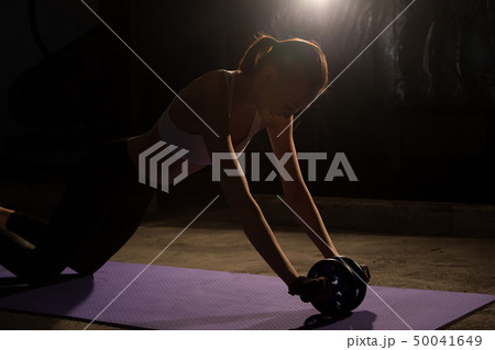 Fitness woman exercise stretch arms legs 50041649