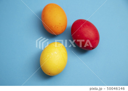 Three easter eggs on blue background 50046146