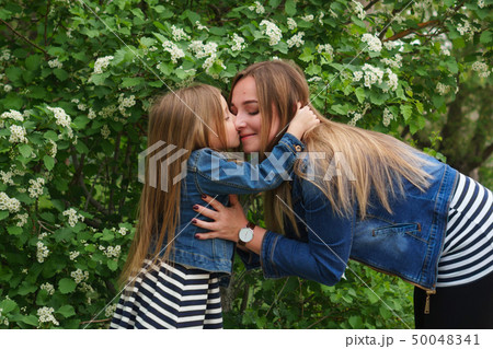 Family. Mother and daughter. Hugs and kisses 50048341
