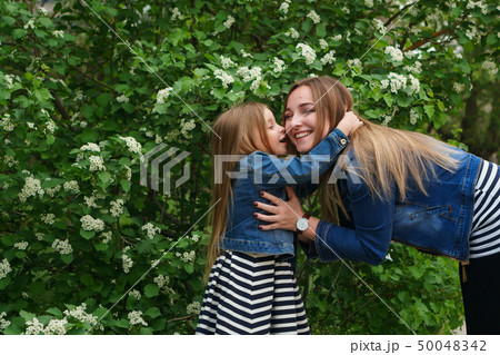 Family. Mother and daughter. Embrace 50048342